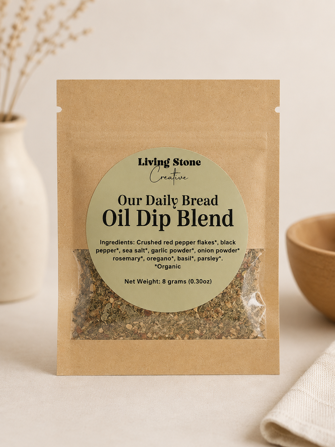 Kraft paper pouch of organic oil dip seasoning blend with a neutral label and clear window showing dried herbs and spices.